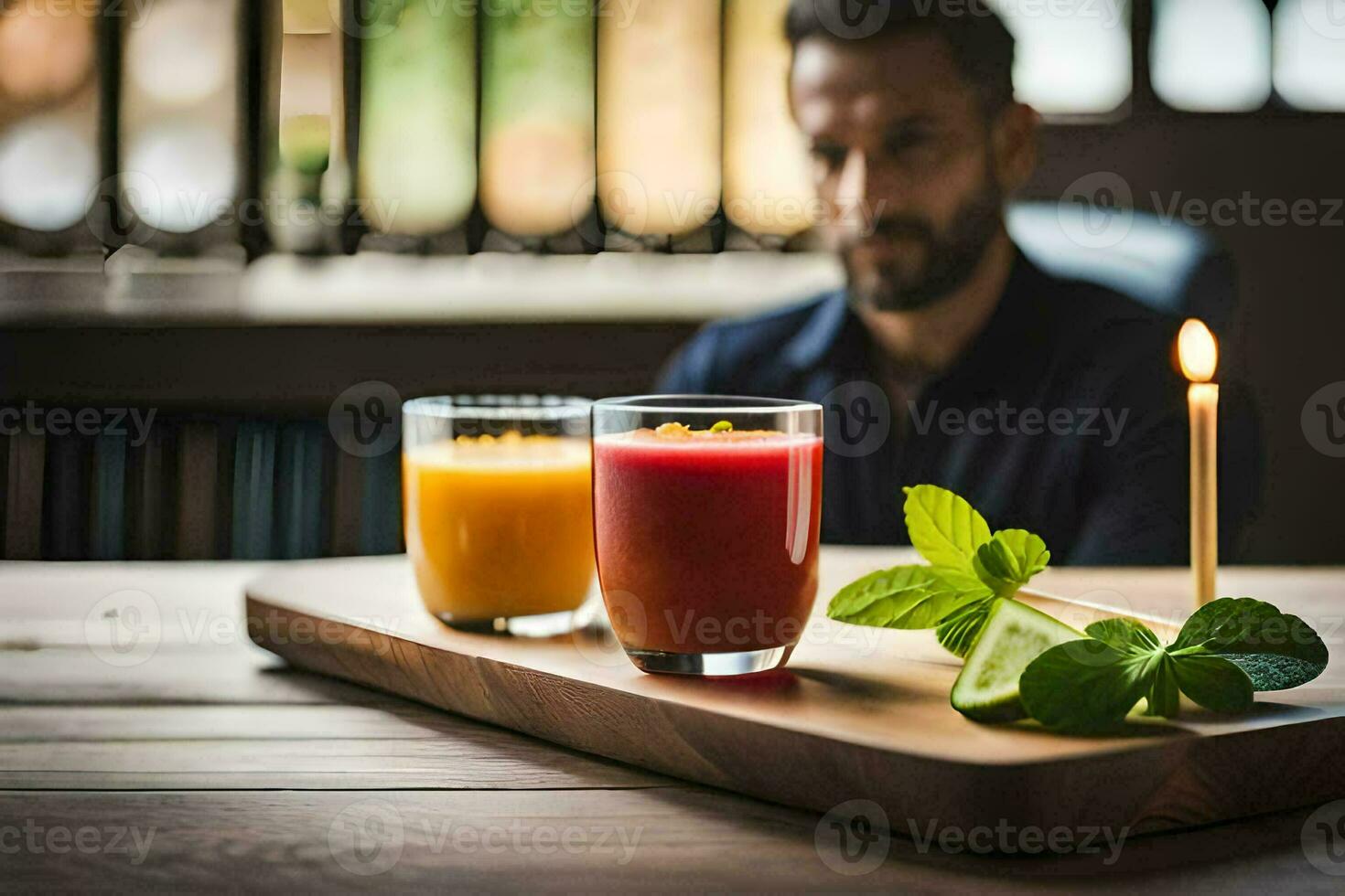 a man sitting at a table with two glasses of juice. AI-Generated photo