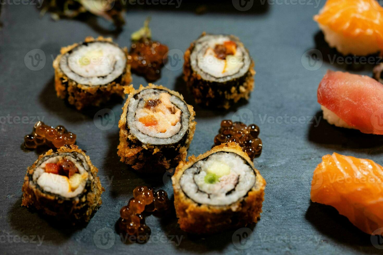 different Kinds of asia seafood sushi on a slate photo