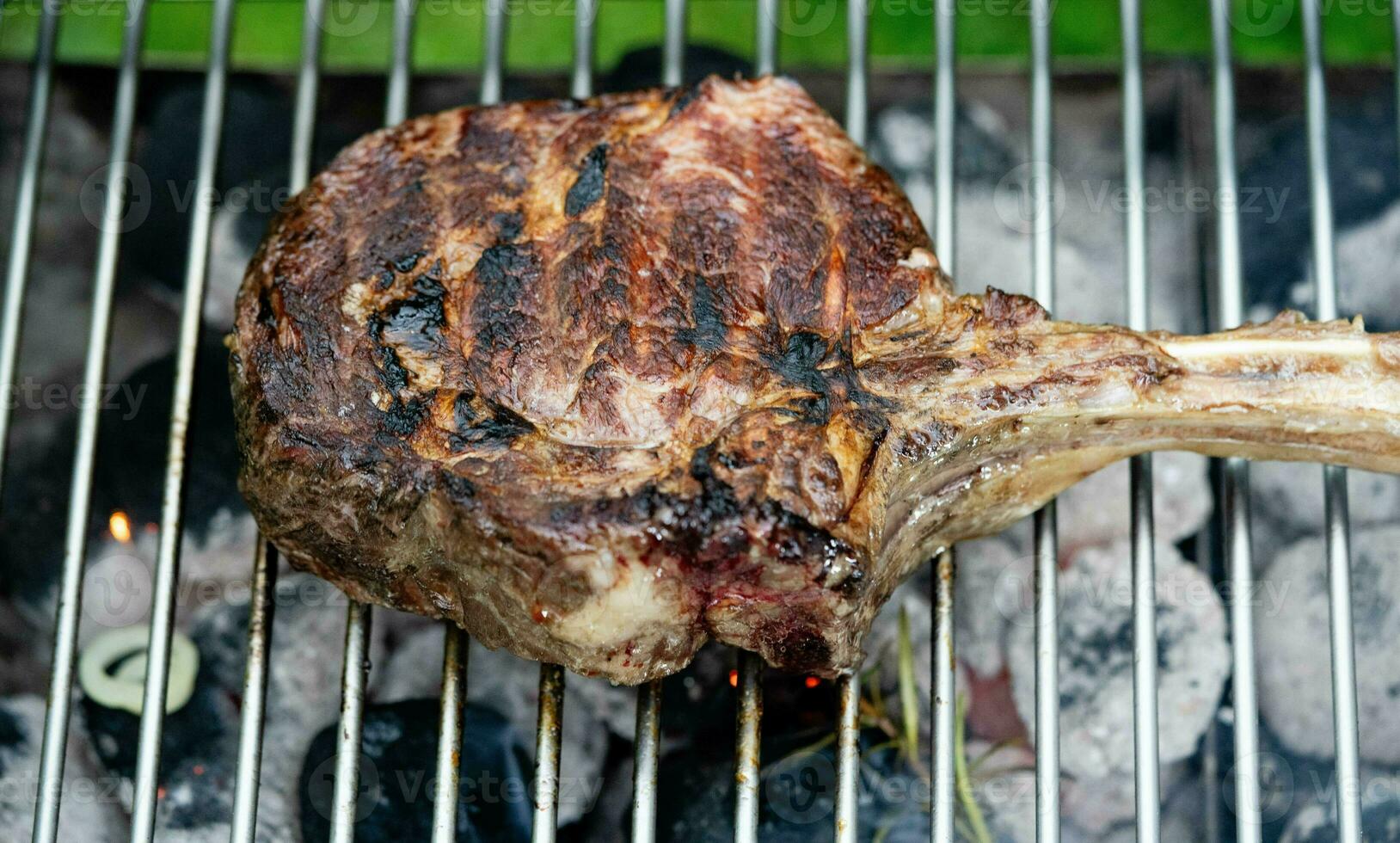 Tomahawk steak with herbs and spices photo