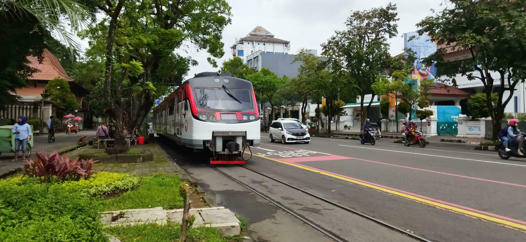 Surakarta, Central Java Indonesia. March 05,2023. Railbus Bathara Kresna crossing Slamet Riyadi street. This railbus operates on the Surakarta Purwosari ke Wonogiri route. photo