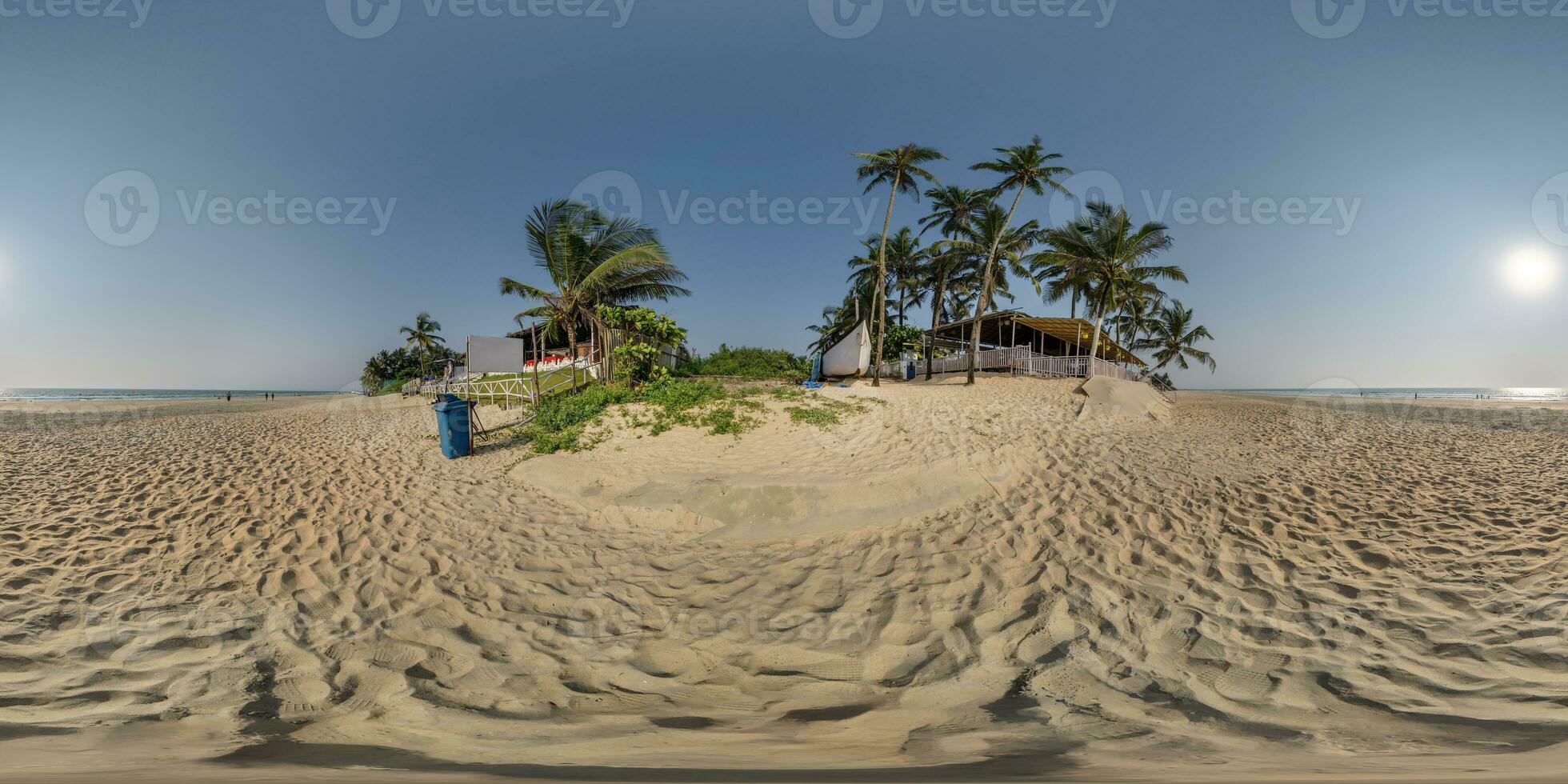 360 hdri panorama with coconut trees on ocean coast near tropical shack or open air cafe on beach in equirectangular spherical seamless projection photo