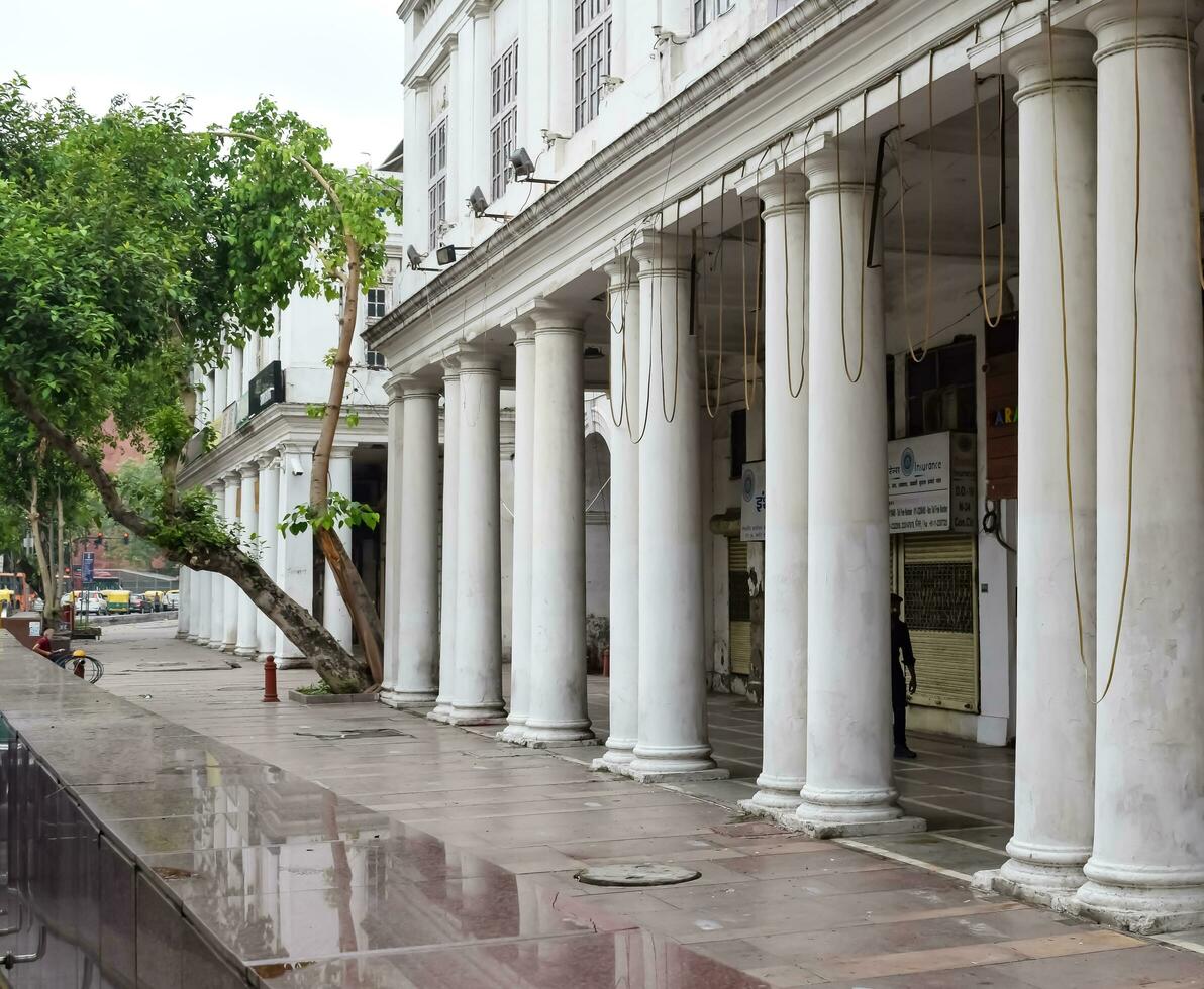Delhi, India, March 31 2023 - Famous business district Connaught Place know as CP Delhi in the centre of New Delhi India with Offices, Banks and Shopping. British style architecture CP in Delhi, India photo