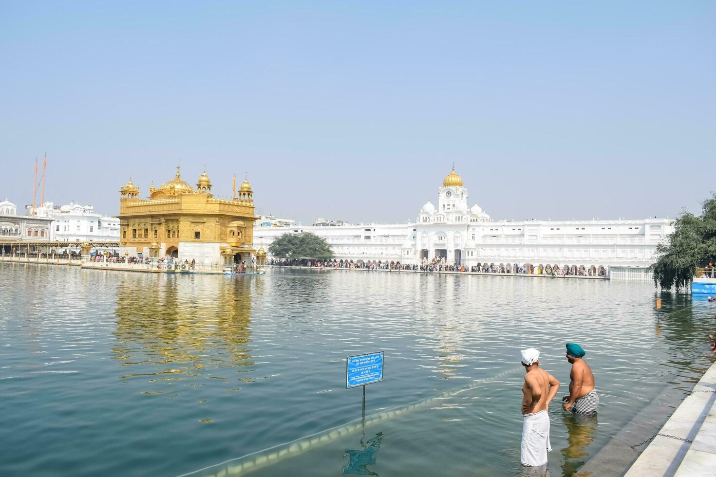 Amritsar, India - February 26 2023 - Unidentified devotees from various parts at Golden Temple Harmandir Sahib in Amritsar, Punjab, India, Famous indian sikh landmark, Golden Temple photo