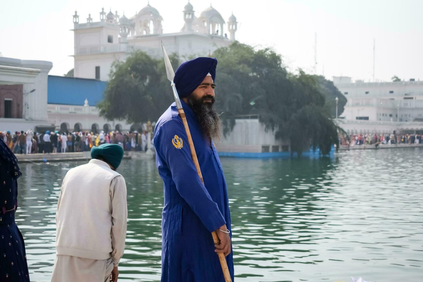 Amritsar, India - February 26 2023 - Unidentified devotees from various parts at Golden Temple Harmandir Sahib in Amritsar, Punjab, India, Famous indian sikh landmark, Golden Temple photo