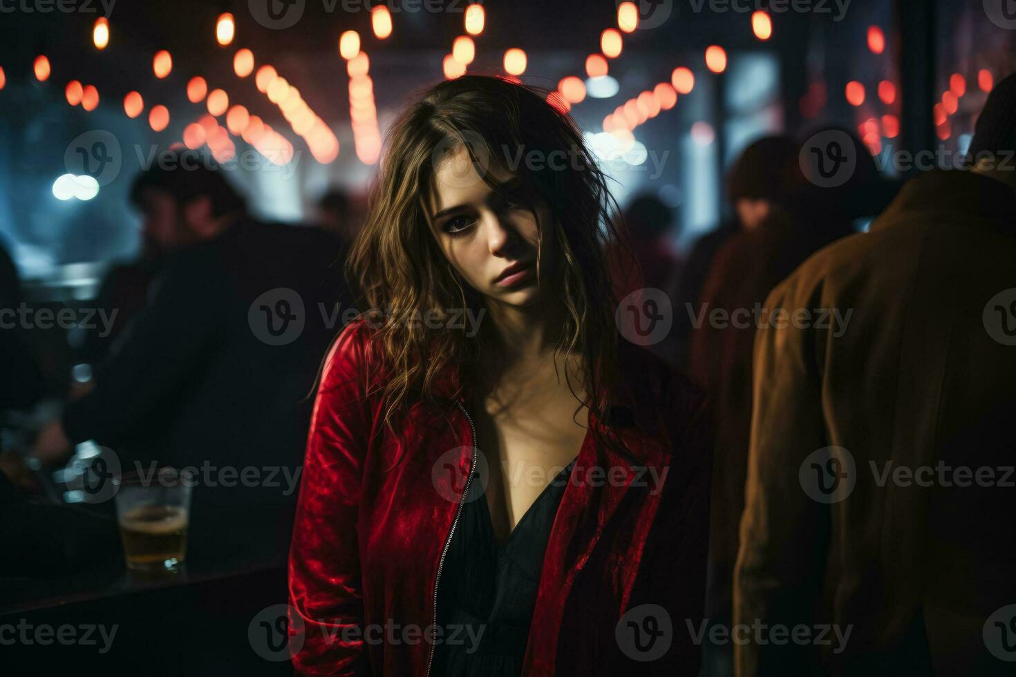 Sad individual lost in thought experiencing melancholy in crowded nightclub photo