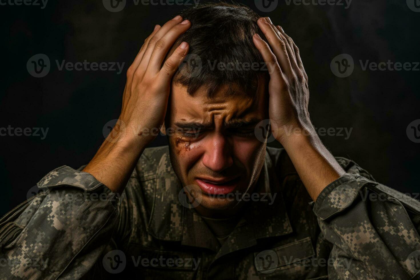 Soldier showing emotional distress in military environment isolated on a gradient background photo