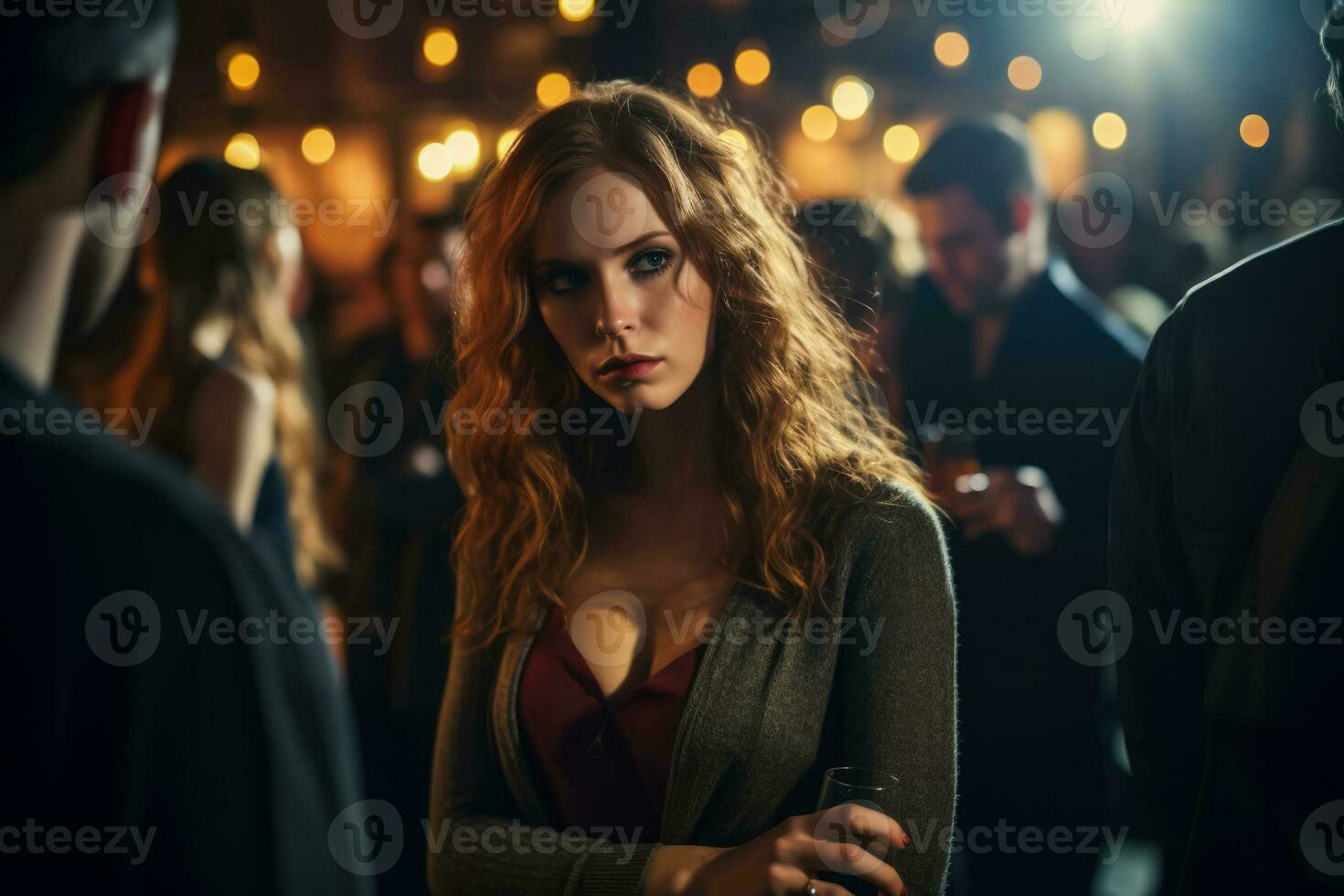Sad individual lost in thought experiencing melancholy in crowded nightclub photo