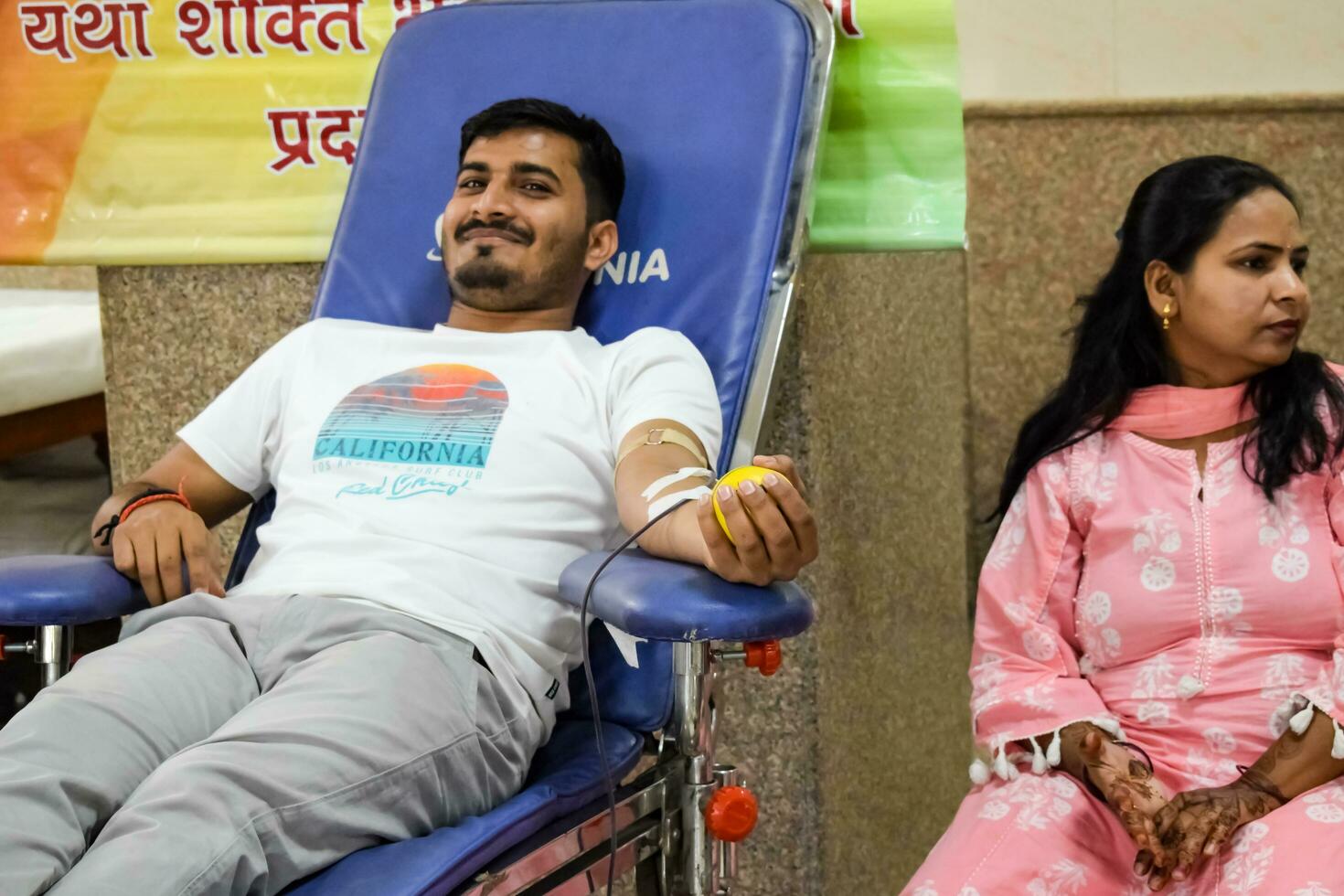 Delhi, India, June 19 2023 - Blood donor at Blood donation camp held at Balaji Temple, Vivek Vihar, Delhi, India, Image for World blood donor day on June 14 every year, Blood Donation Camp at Temple photo