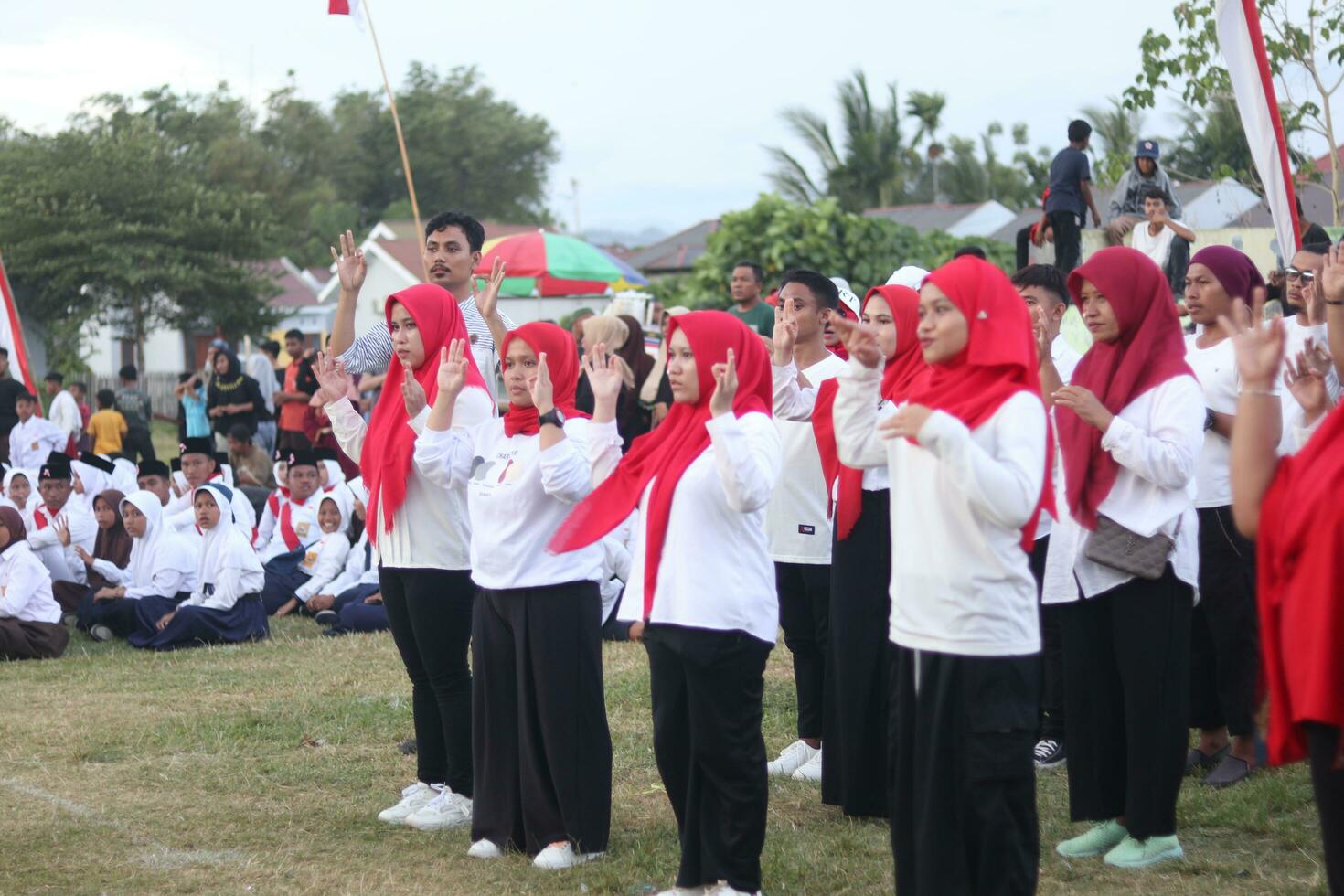 Gorontalo, Indonesia - August 17, 2023 - A group of hearing-impaired individuals becomes a choir guide group during the commemoration of Indonesia's 78th Independence Day photo
