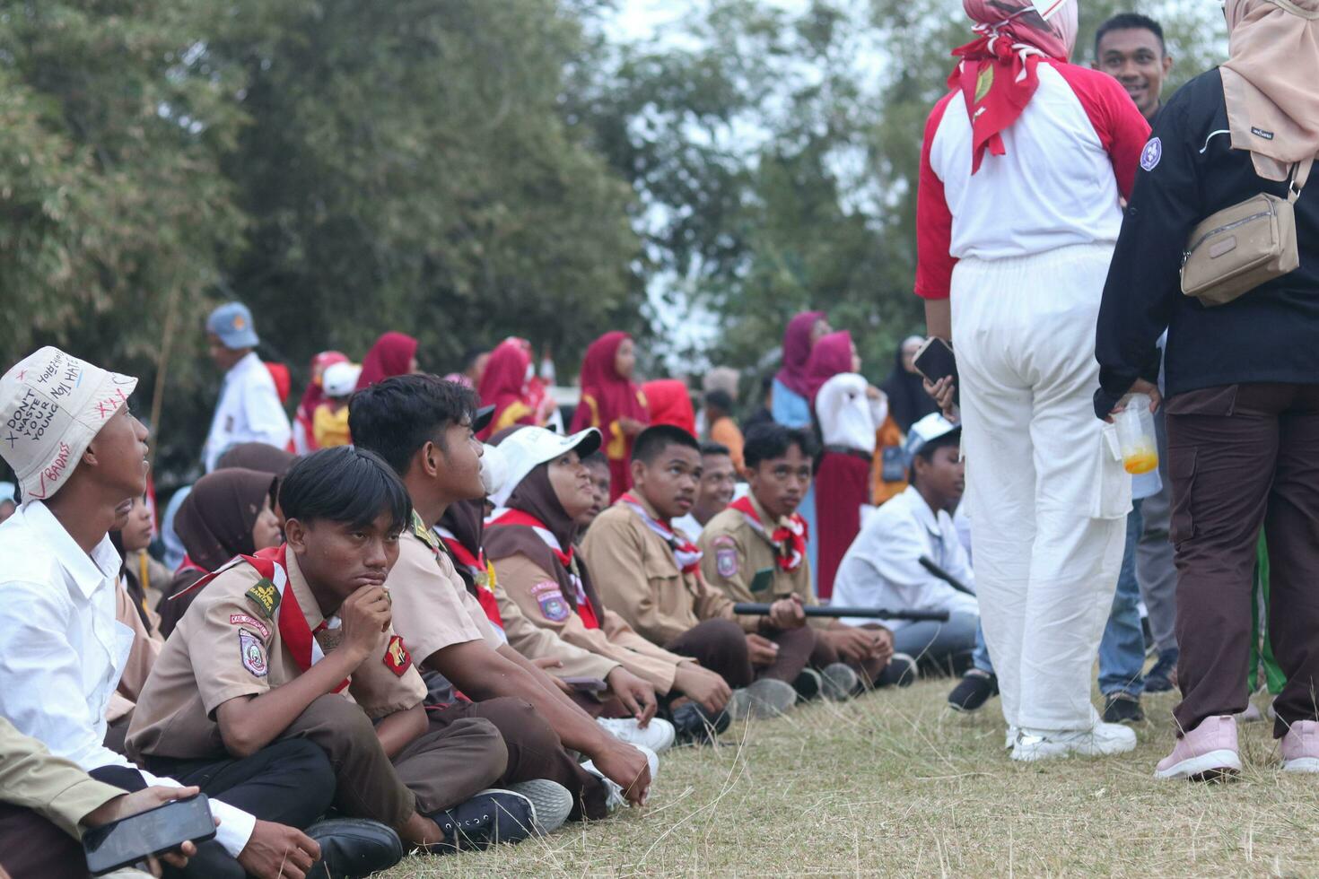 Gorontalo, Indonesia - August 17, 2023 - Scout members assisted in the organization of the flag lowering ceremony during the 78th Independence Day of Indonesia. Anggota pramuka photo
