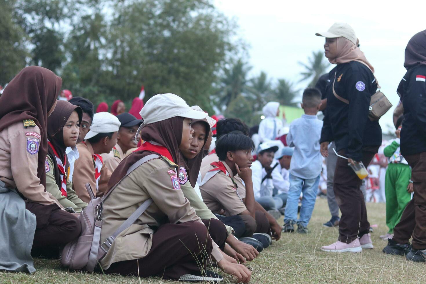 Gorontalo, Indonesia - August 17, 2023 - Scout members assisted in the organization of the flag lowering ceremony during the 78th Independence Day of Indonesia. Anggota pramuka photo