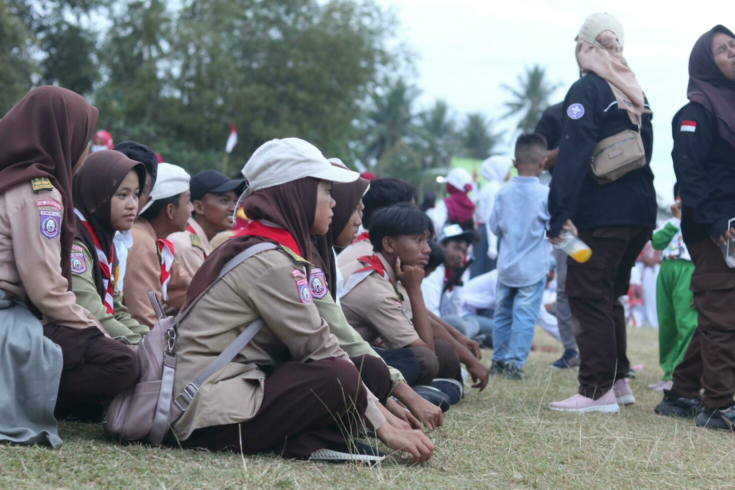 Gorontalo, Indonesia - August 17, 2023 - Scout members assisted in the organization of the flag lowering ceremony during the 78th Independence Day of Indonesia. Anggota pramuka photo