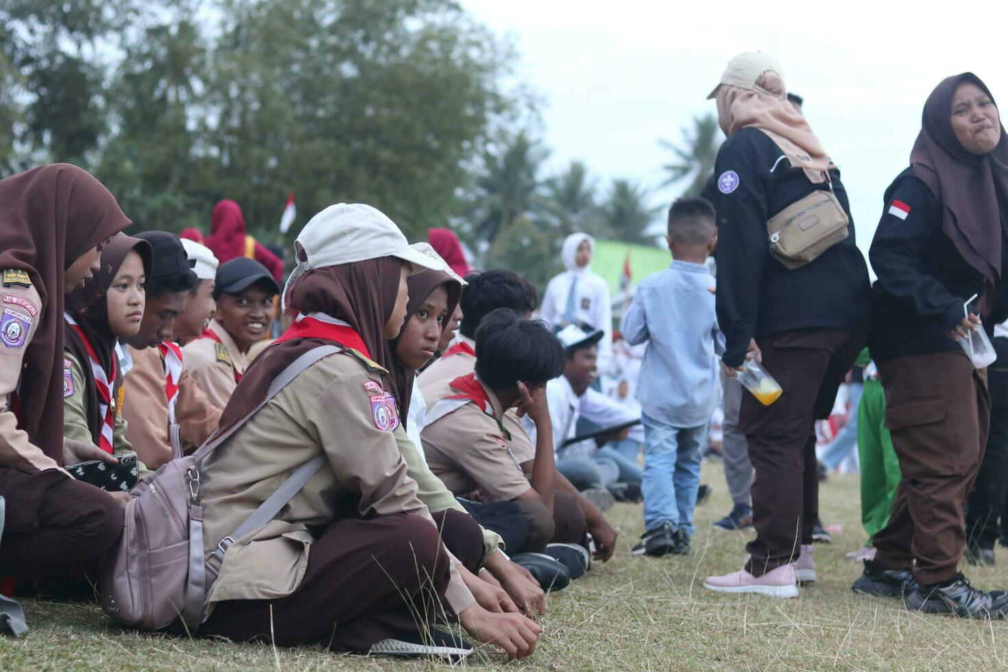 Gorontalo, Indonesia - August 17, 2023 - Scout members assisted in the organization of the flag lowering ceremony during the 78th Independence Day of Indonesia. Anggota pramuka photo