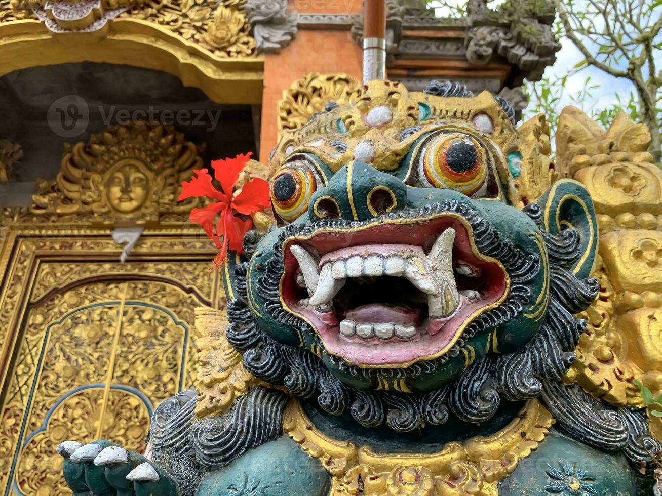 Traditional old ancient Balinese statue of demon angel called barong bali guarding sacred ritual temple photo