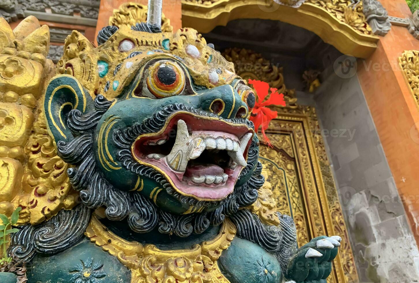 Traditional old ancient Balinese statue of demon angel called barong bali guarding sacred ritual temple photo