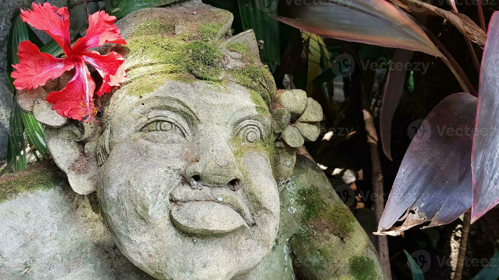 Beautiful artistic Bali stone statue of a Balinese ancient garden statue used as garden decoration, javanese gnome indonesia photo