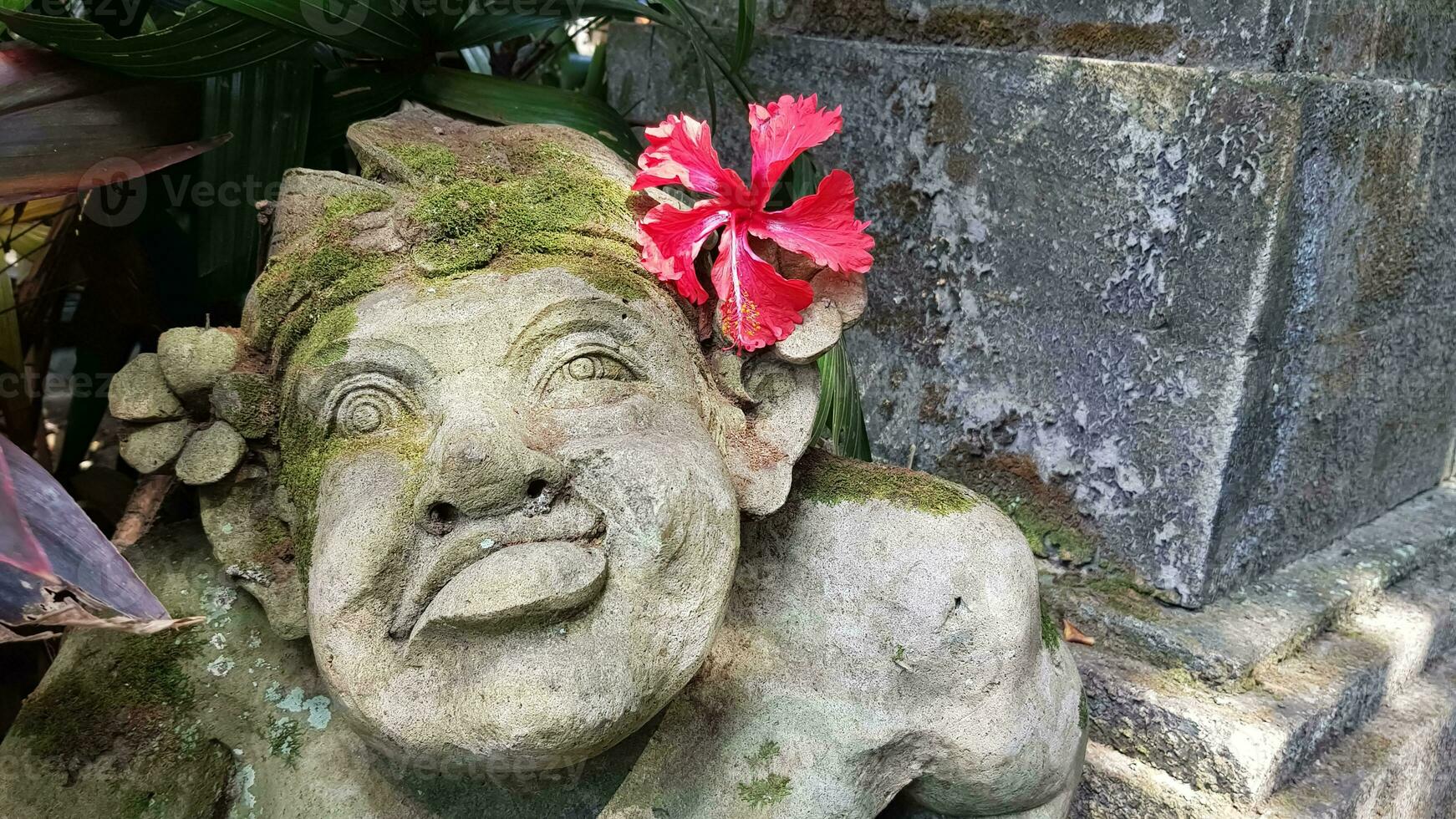 Beautiful artistic Bali stone statue of a Balinese ancient garden statue used as garden decoration, javanese gnome indonesia photo