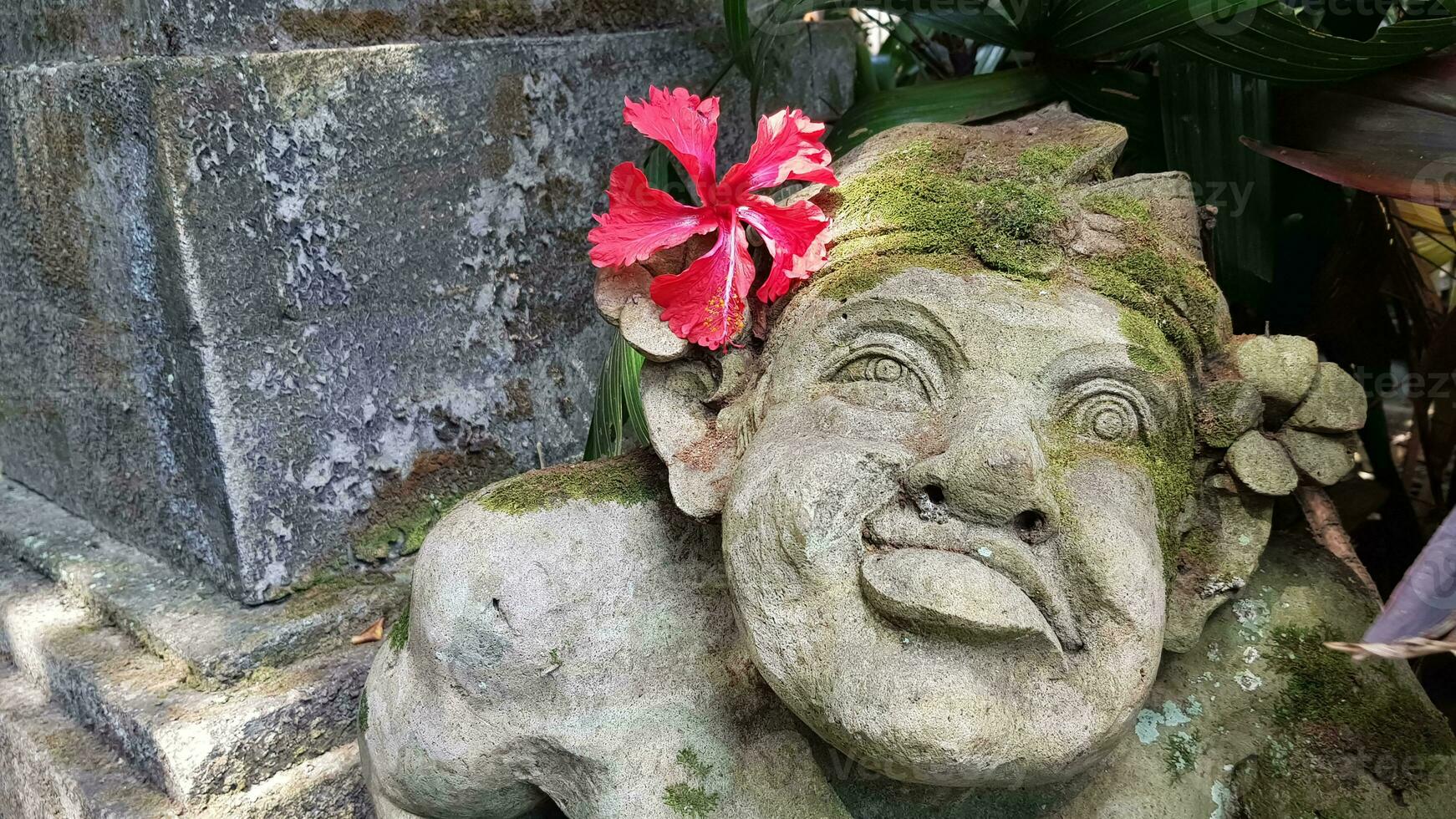 Beautiful artistic Bali stone statue of a Balinese ancient garden statue used as garden decoration, javanese gnome indonesia photo