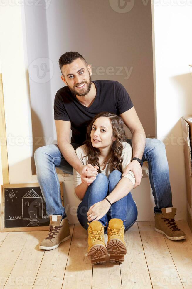 young couple moves into new home photo