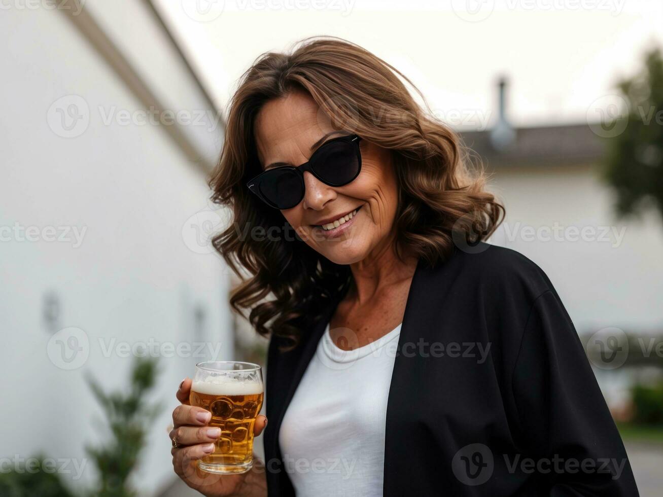 senior women in sunglasses holding glass of bear.AI Generative photo