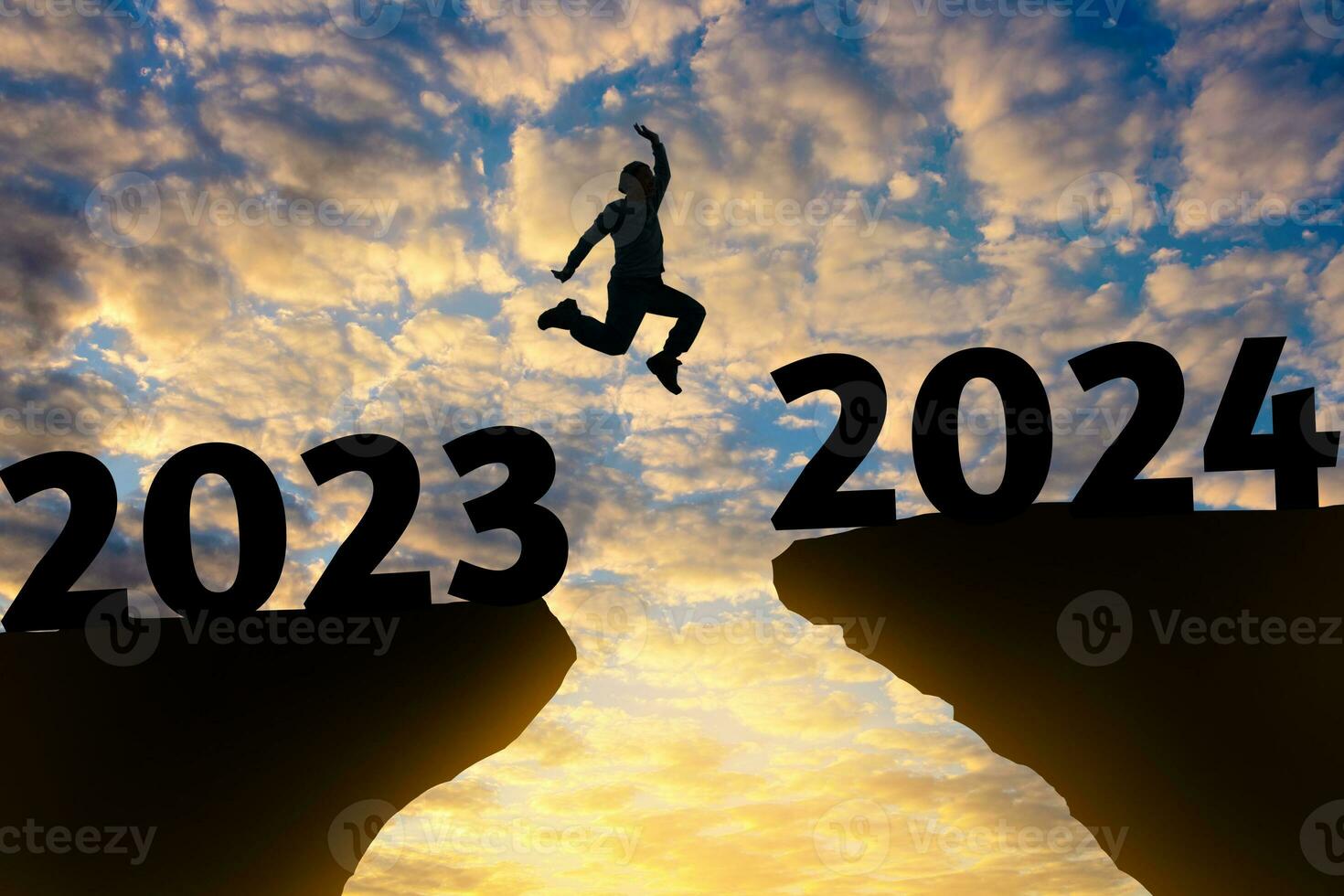 Happy new year Silhouette sunset background.A man are jumping over to