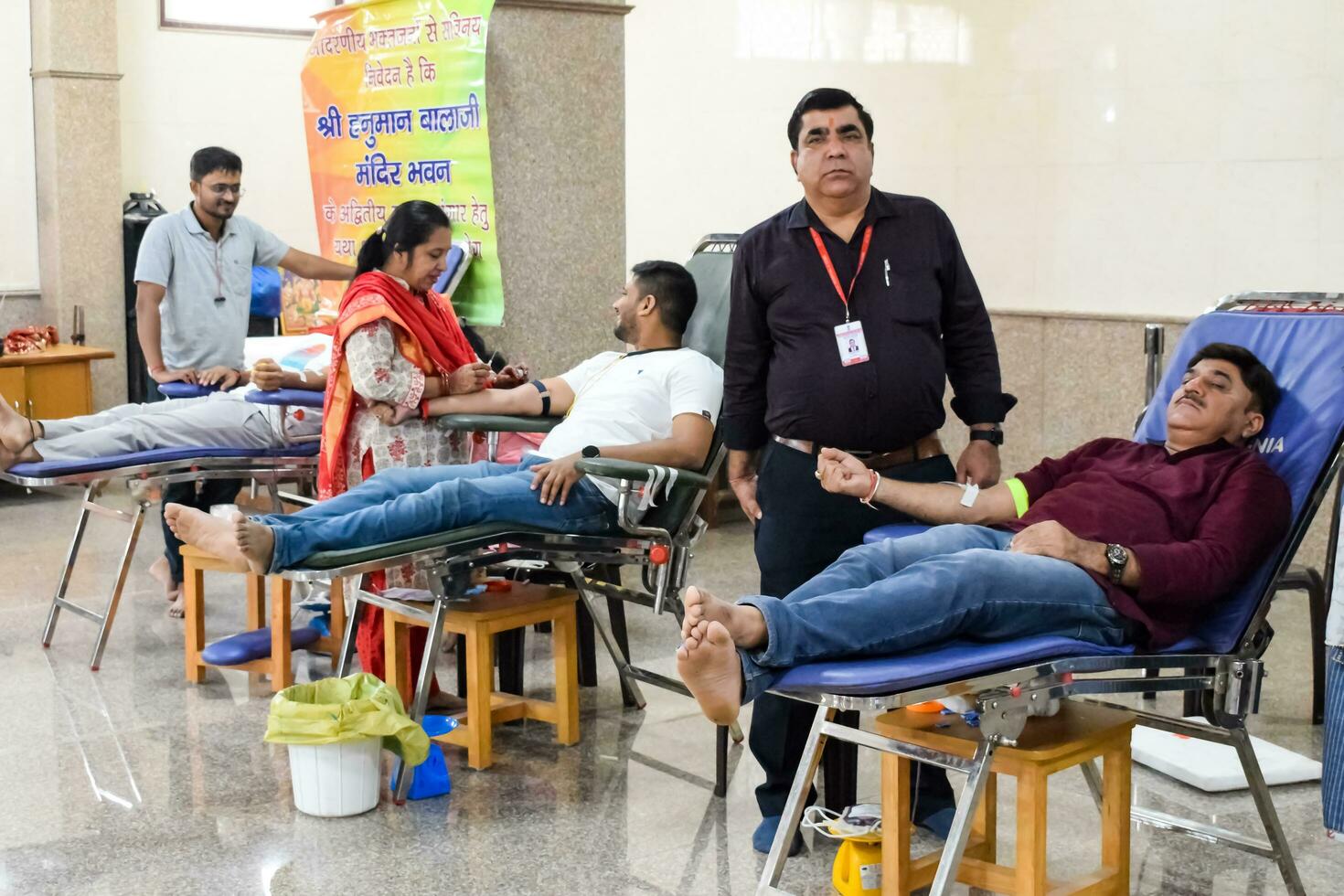 Delhi, India, June 19 2023 - Blood donor at Blood donation camp held at Balaji Temple, Vivek Vihar, Delhi, India, Image for World blood donor day on June 14 every year, Blood Donation Camp at Temple photo
