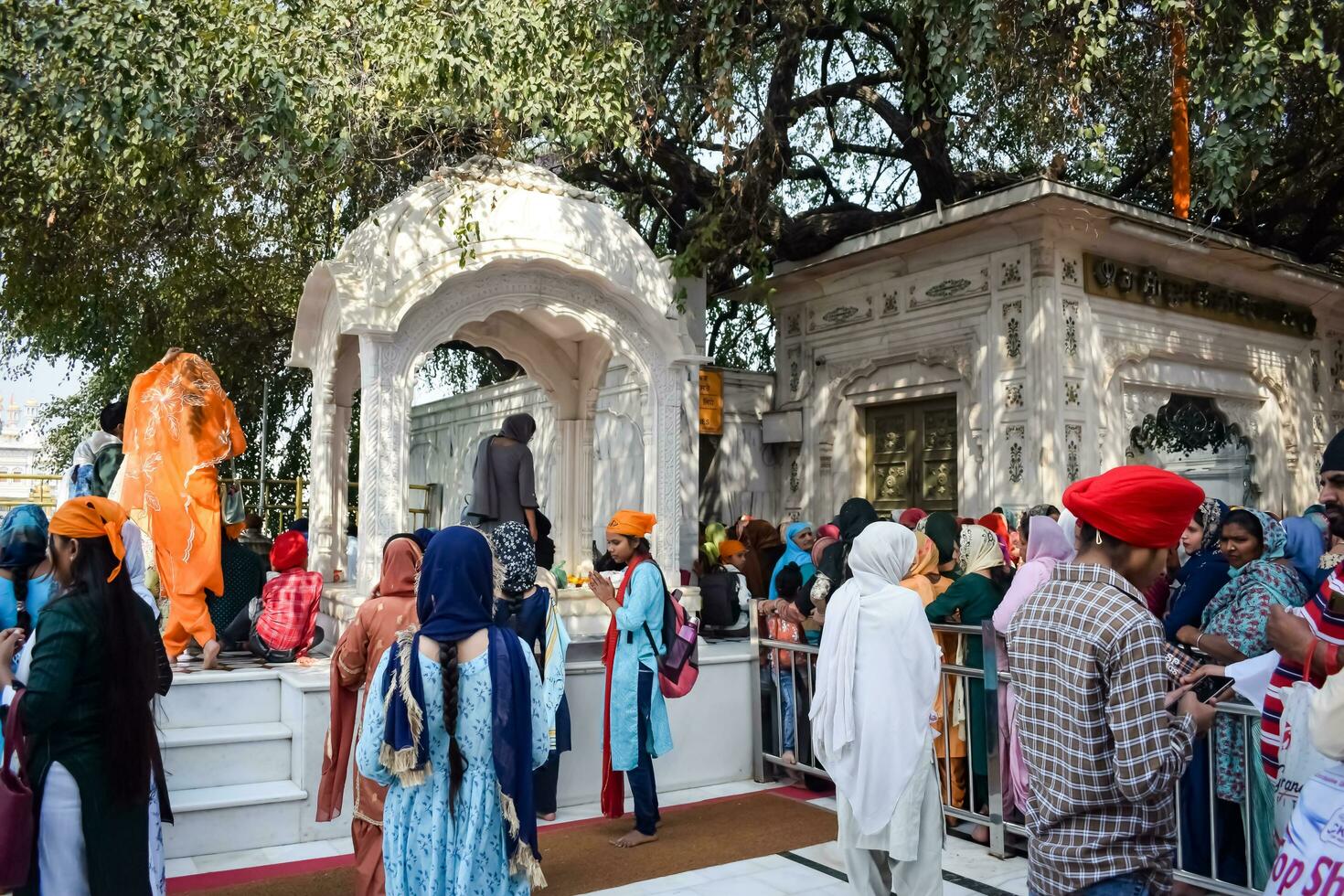 Amritsar, India - February 26 2023 - Unidentified devotees from various parts at Golden Temple Harmandir Sahib in Amritsar, Punjab, India, Famous indian sikh landmark, Golden Temple photo