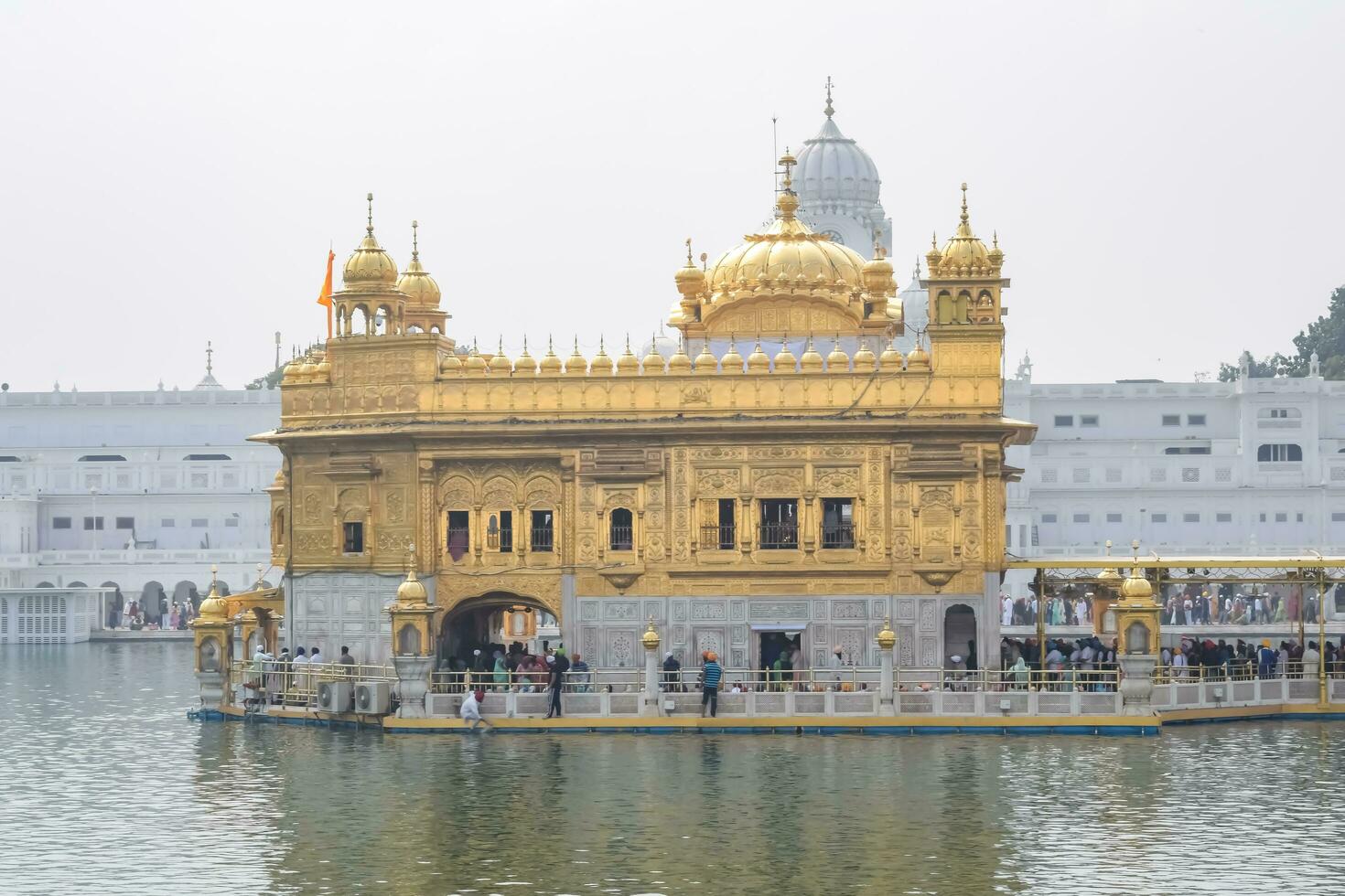 Amritsar, India - February 26 2023 - Unidentified devotees from various parts at Golden Temple Harmandir Sahib in Amritsar, Punjab, India, Famous indian sikh landmark, Golden Temple photo