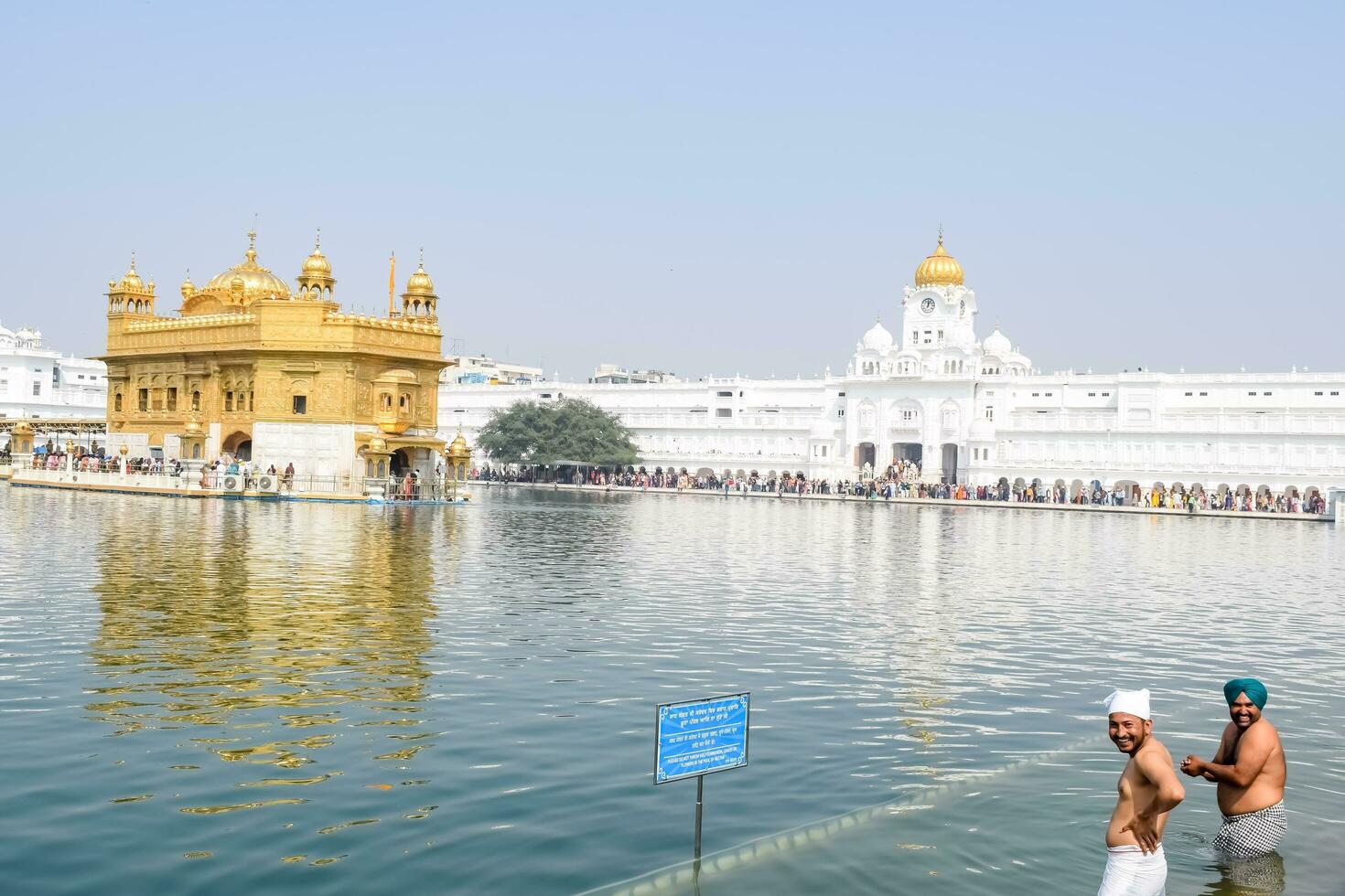 Amritsar, India - February 26 2023 - Unidentified devotees from various parts at Golden Temple Harmandir Sahib in Amritsar, Punjab, India, Famous indian sikh landmark, Golden Temple photo