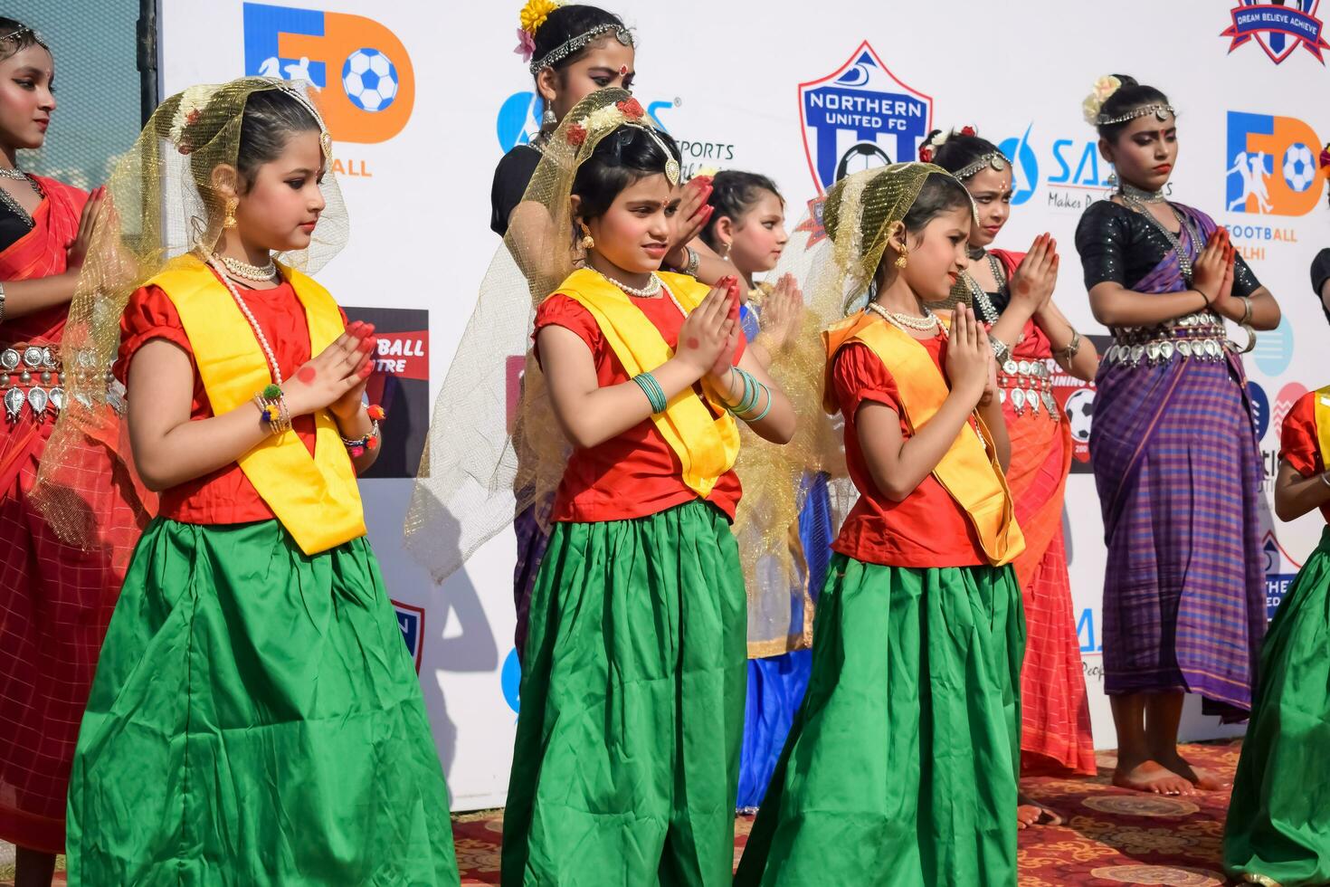 New Delhi, India - July 01 2023 - Bharathanatyam Indian classical odissi dancers performing at stage. Beautiful Indian girl dancers in the posture of Indian dance. Indian classical dance Bharatanatyam photo