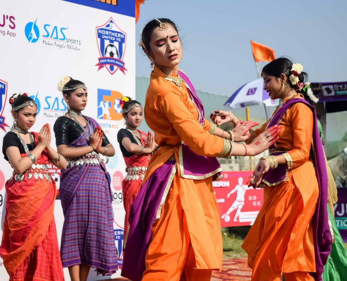 New Delhi, India - July 01 2023 - Bharathanatyam Indian classical odissi dancers performing at stage. Beautiful Indian girl dancers in the posture of Indian dance. Indian classical dance Bharatanatyam photo