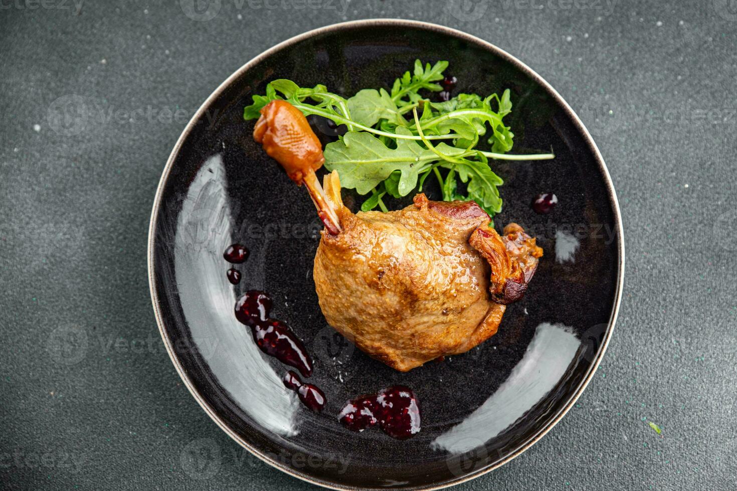 duck leg confit berry sauce poultry meat eating cooking appetizer meal food snack on the table photo