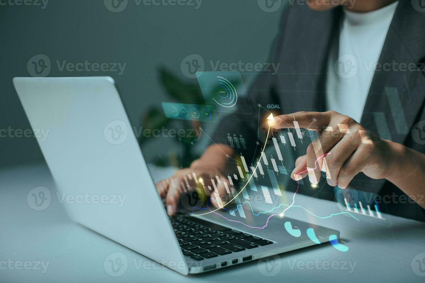 The analyst works on a laptop showing data business analysis and Data Management System with KPI for financial report and data analysis, business target and development. photo