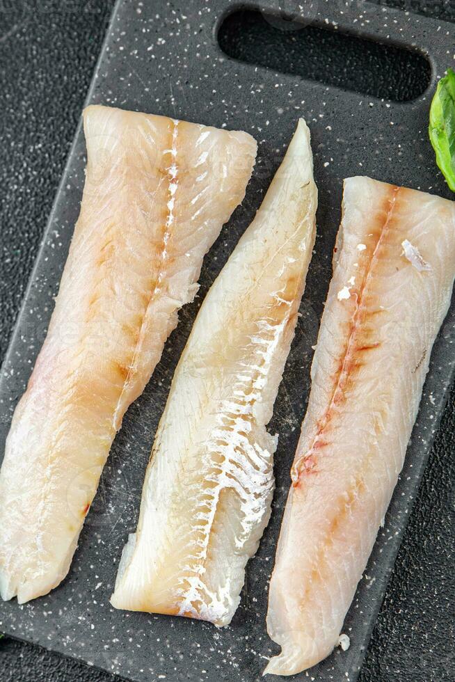 blue whiting fish fillet fresh seafood delicious healthy eating Pescetarian cooking appetizer meal food snack on the table copy space food background rustic top view photo