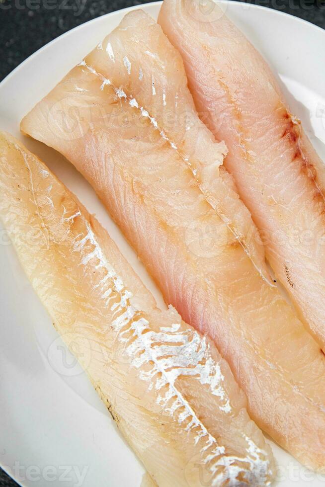 fish fish fillet blue whiting fresh seafood eating cooking appetizer meal food snack on the table copy space food background rustic top view photo