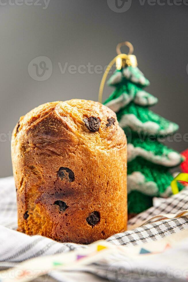 panettone christmas dessert dbaking sweet pastry dried fruits chocolate sweet holiday treat new year celebration meal food snack on the table copy space food background rustic photo