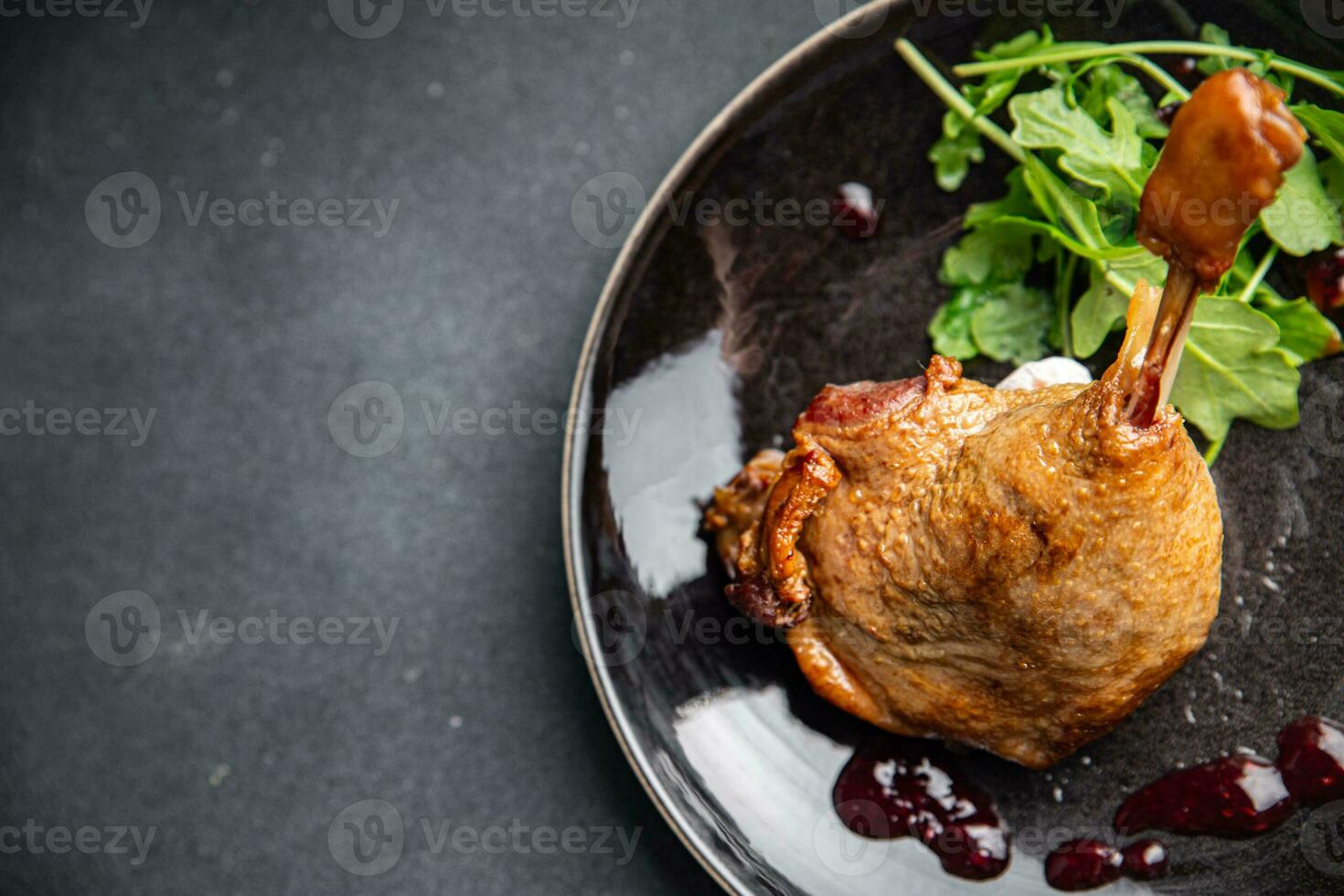 duck leg confit berry sauce poultry meat eating cooking appetizer meal food snack on the table photo