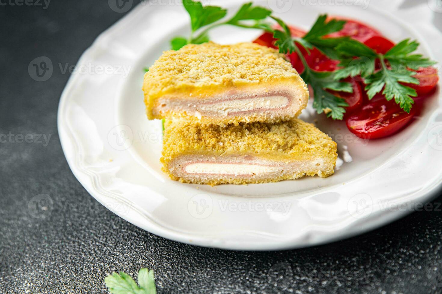 cordon bleu fresh cutlet chicken meat, cheese, bacon appetizer meal food snack on the table photo