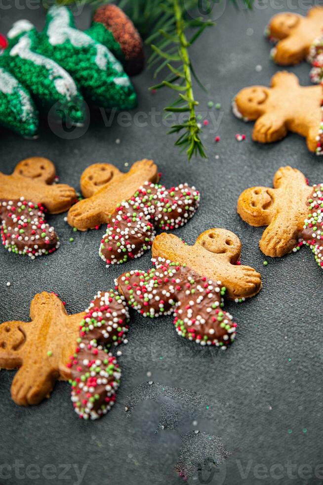 gingerbread man christmas cookie christmas sweet dessert holiday baking treat new year and celebration meal food snack on the table copy space food background photo