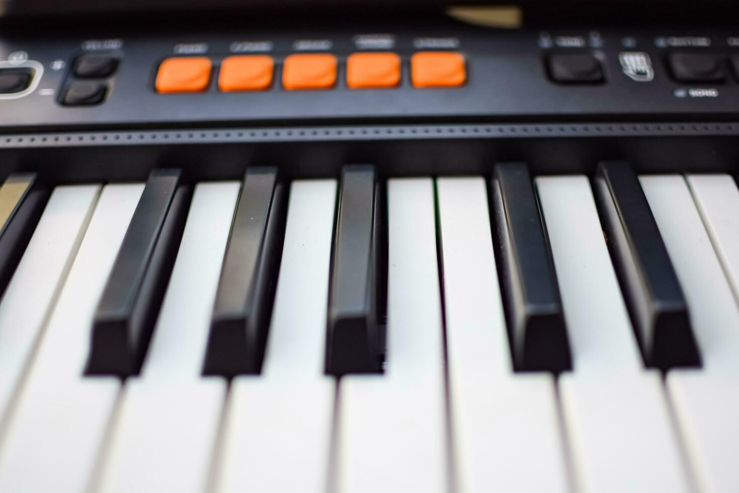 Close-up of piano keys. Piano black and white keys and Piano keyboard musical instrument placed at the home balcony during sunny day. photo