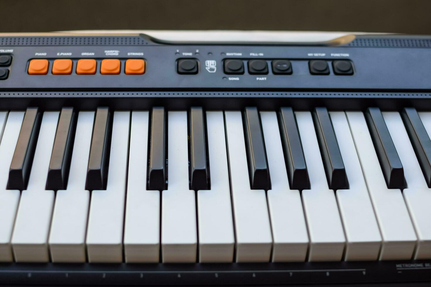 Close-up of piano keys. Piano black and white keys and Piano keyboard musical instrument placed at the home balcony during sunny day. photo