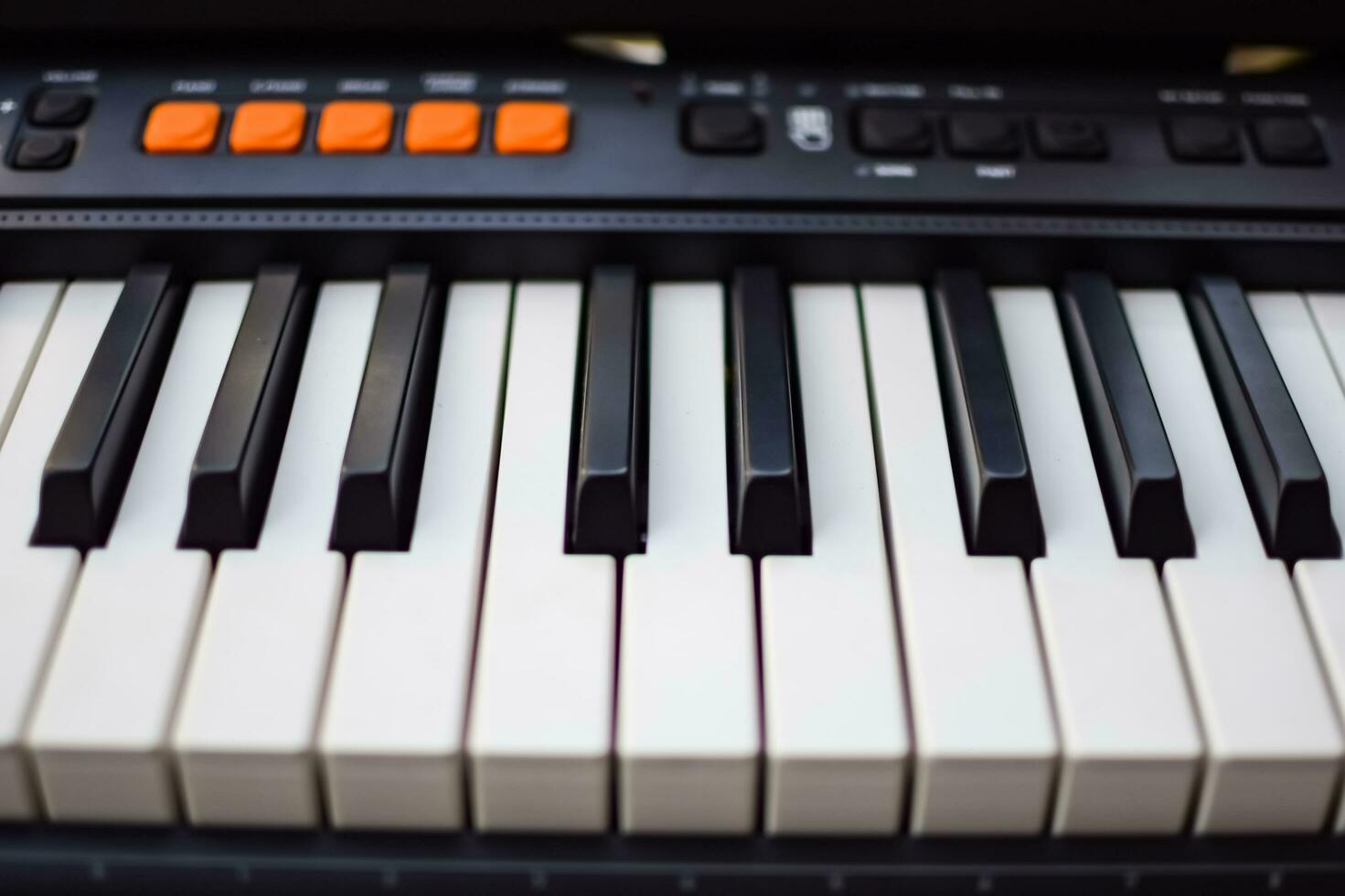 Close-up of piano keys. Piano black and white keys and Piano keyboard musical instrument placed at the home balcony during sunny day. photo