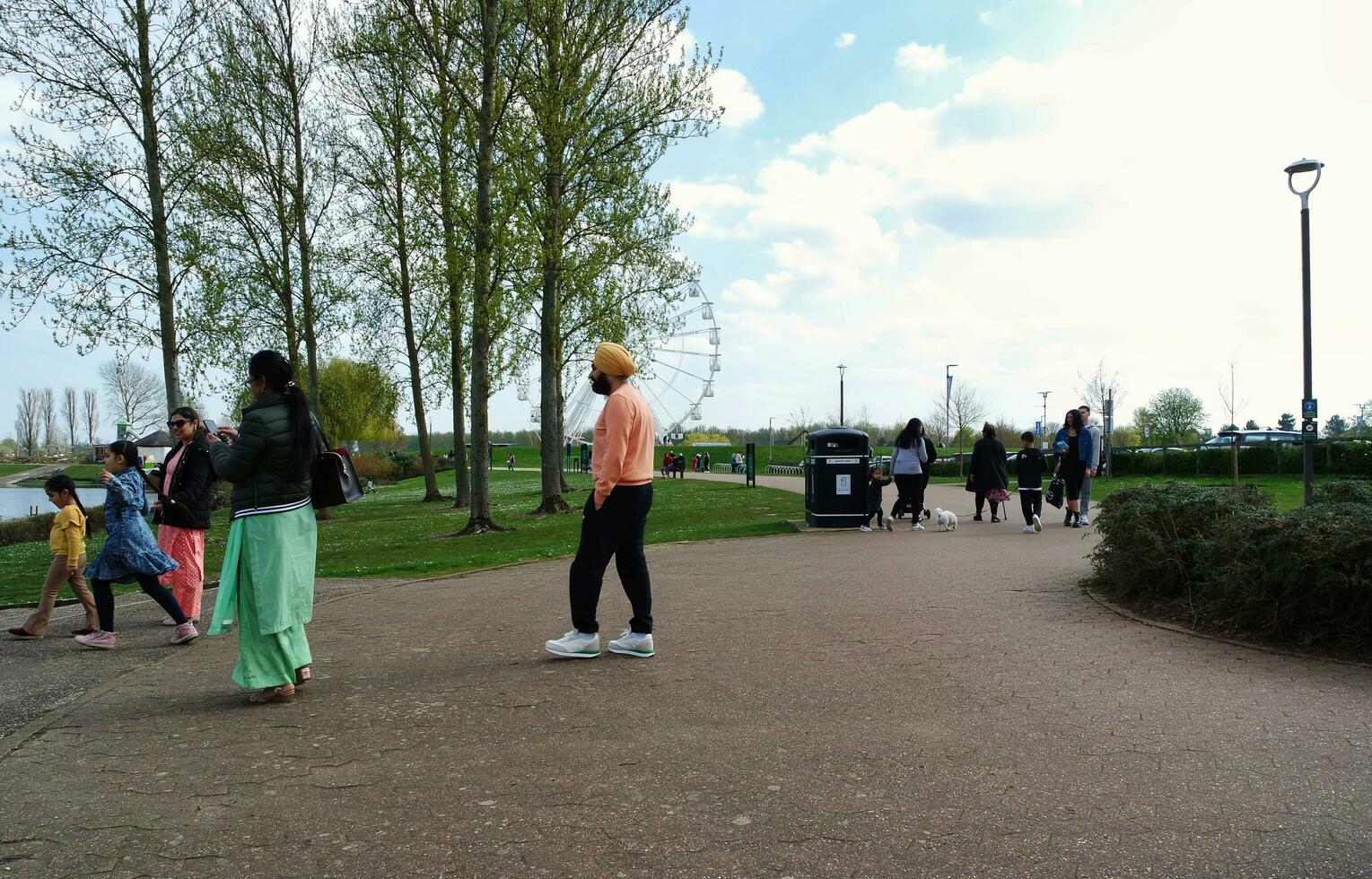 Beautiful view of People Walking and Visiting the Willen Lake of Milton Keynes City of England UK, Image Captured on April 9th, 2023 photo