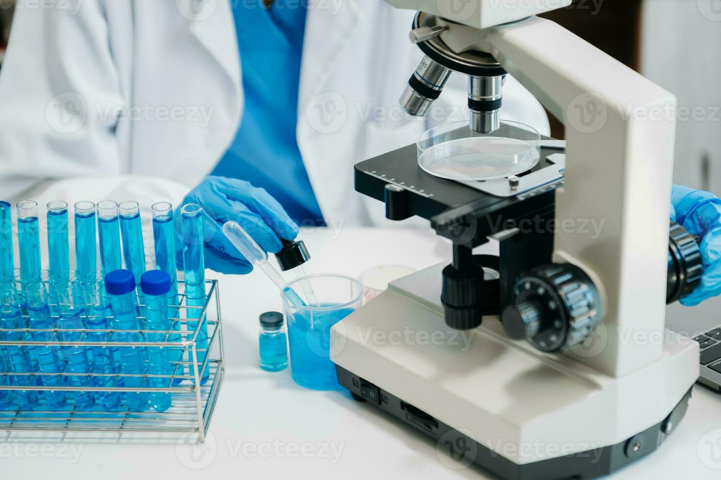 Modern medical research laboratory. female scientist working with micro pipettes analyzing biochemical samples, advanced science chemical laboratory photo