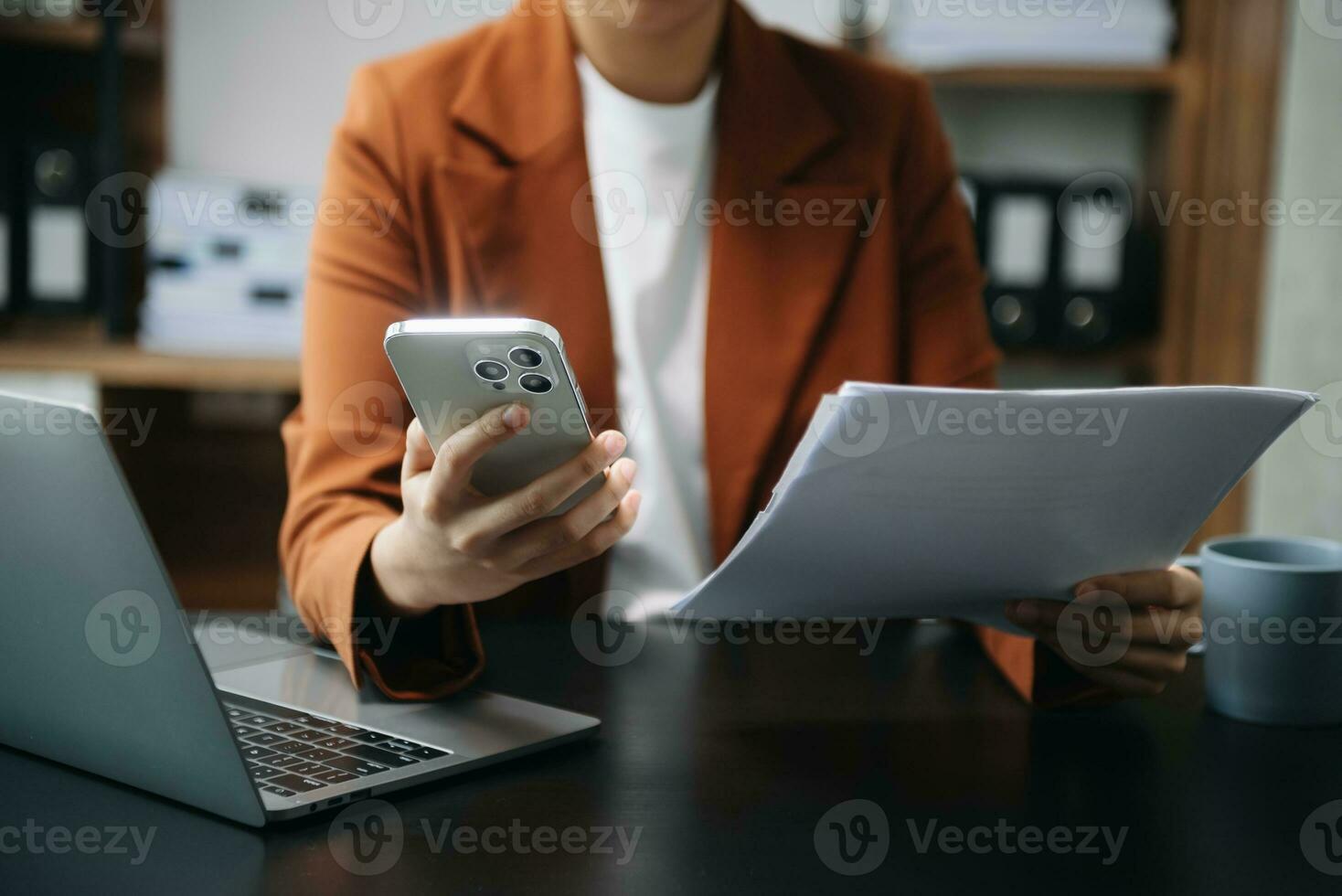 Businesswoman hand using laptop, tablet and smartphone in office. Digital marketing media mobile app and discussing plan new start up project. Finance task. photo