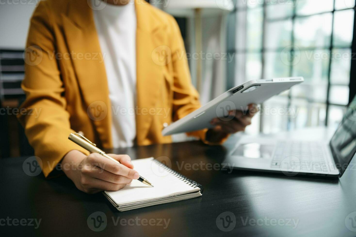 businesswoman hand working with new modern computer and writing on the notepad strategy diagram as concept photo