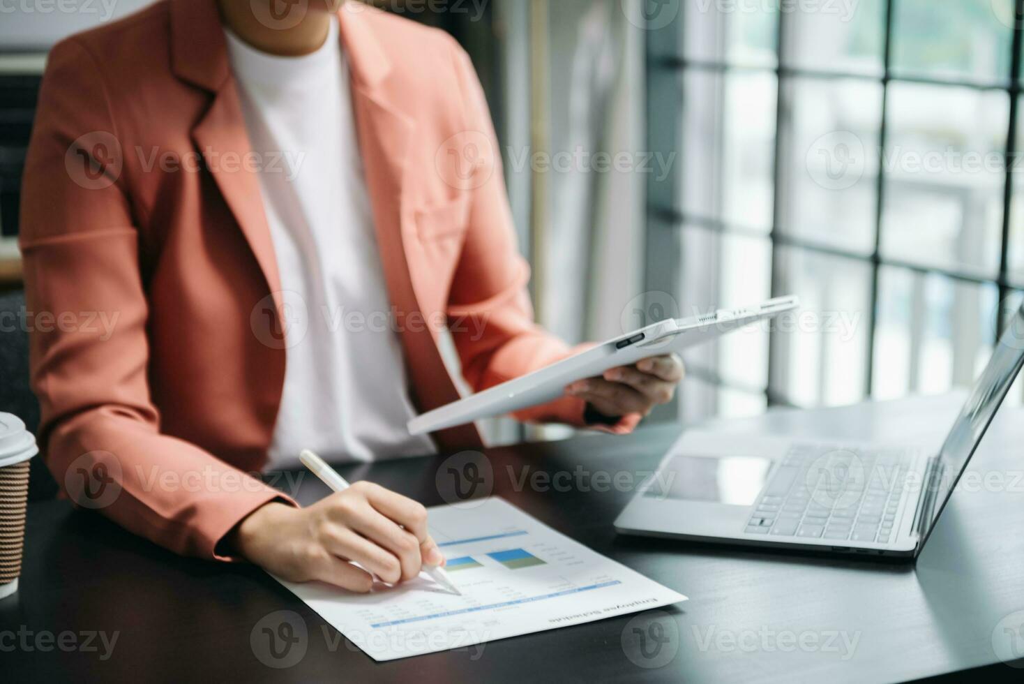 Businesswoman hand using laptop, tablet and smartphone in office. Digital marketing media mobile app and discussing plan new start up project. Finance task. photo