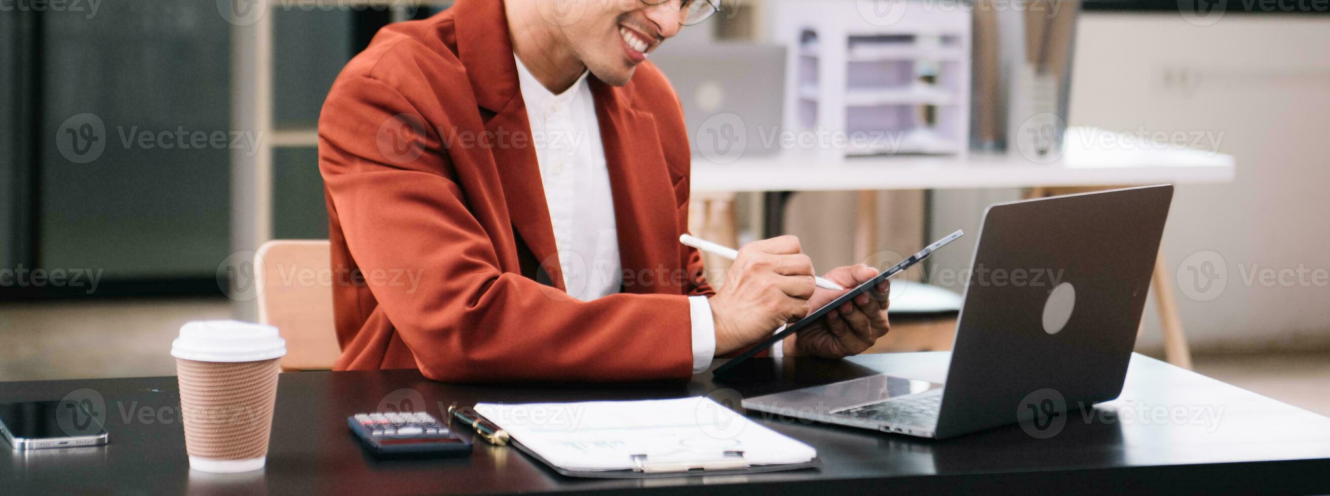 Businessman using on smartphone and tablet and laptop at moderm office as concept photo