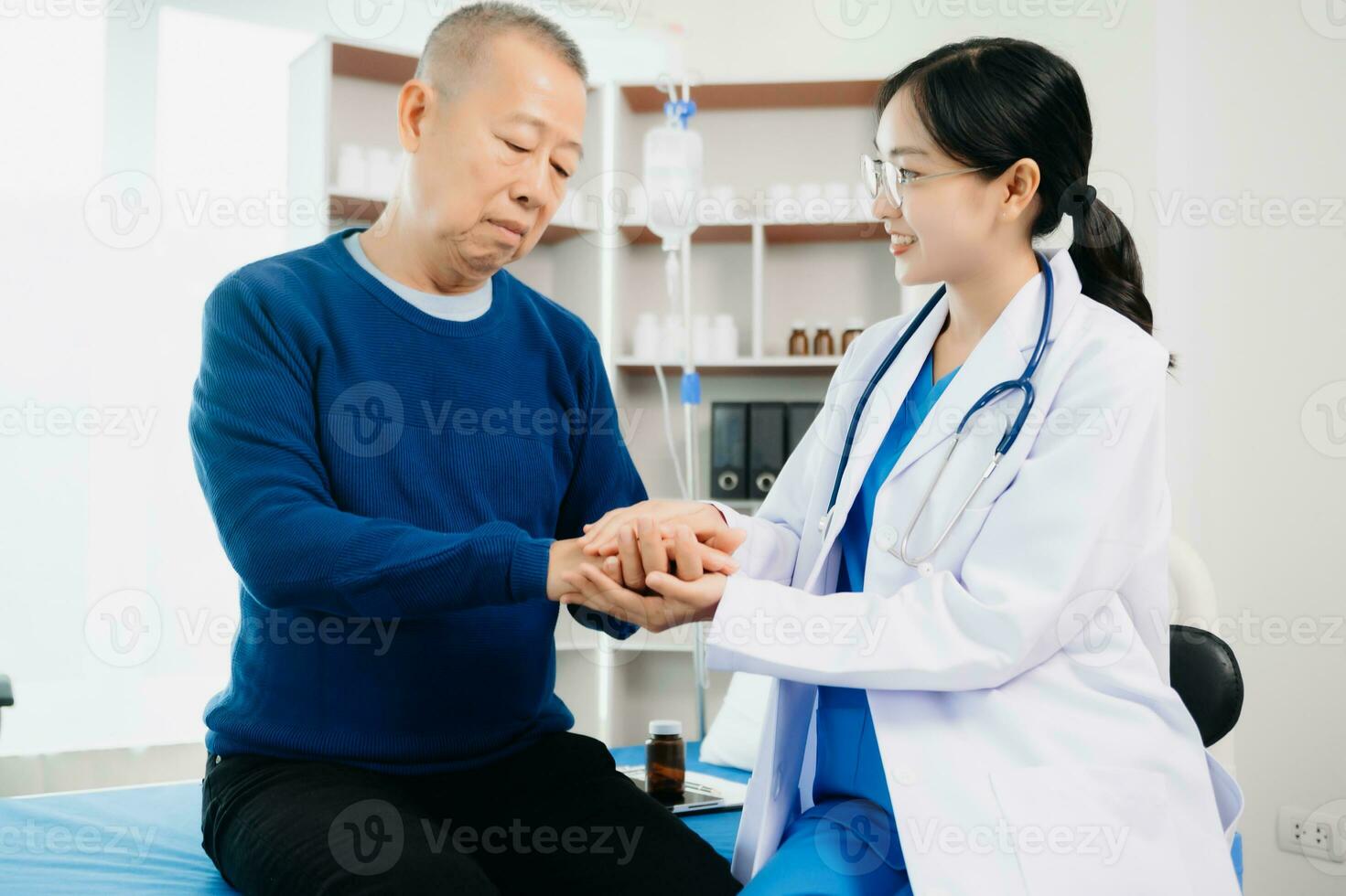 The doctor holds the patient s. hand Healthcare and medical concept. photo