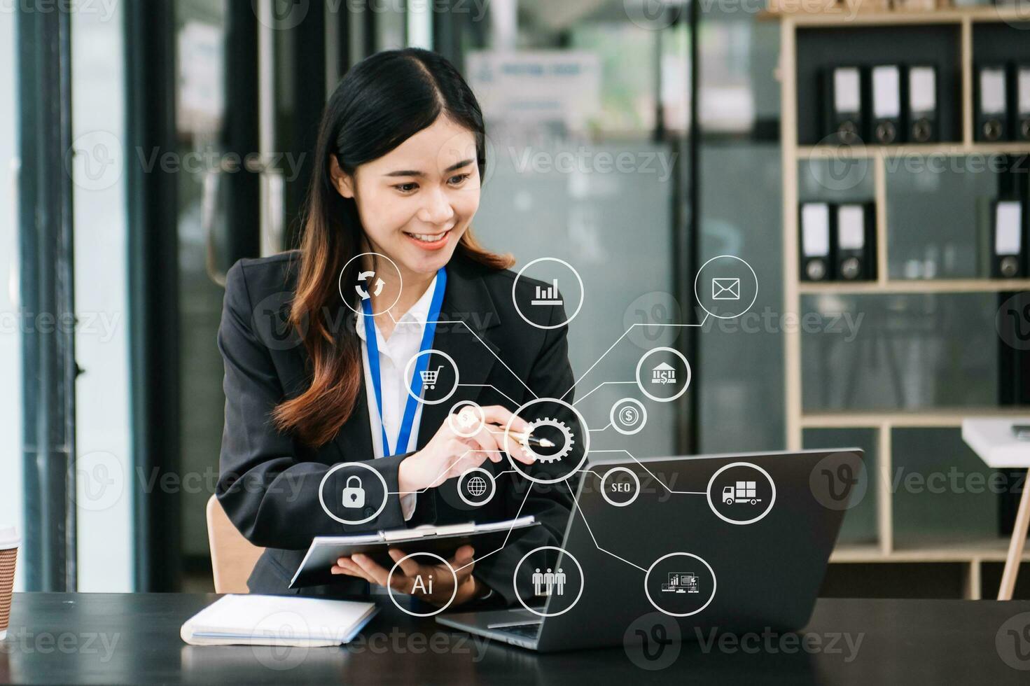 Asian Businesswoman working with smart phone and laptop and digital tablet computer in office with digital marketing media in virtual icon photo